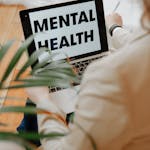 The Words Mental Health on Laptop Screen